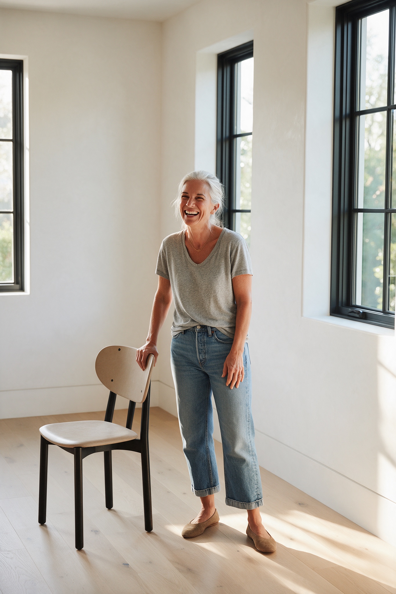 A homeowner alone in an empty room, considering the space