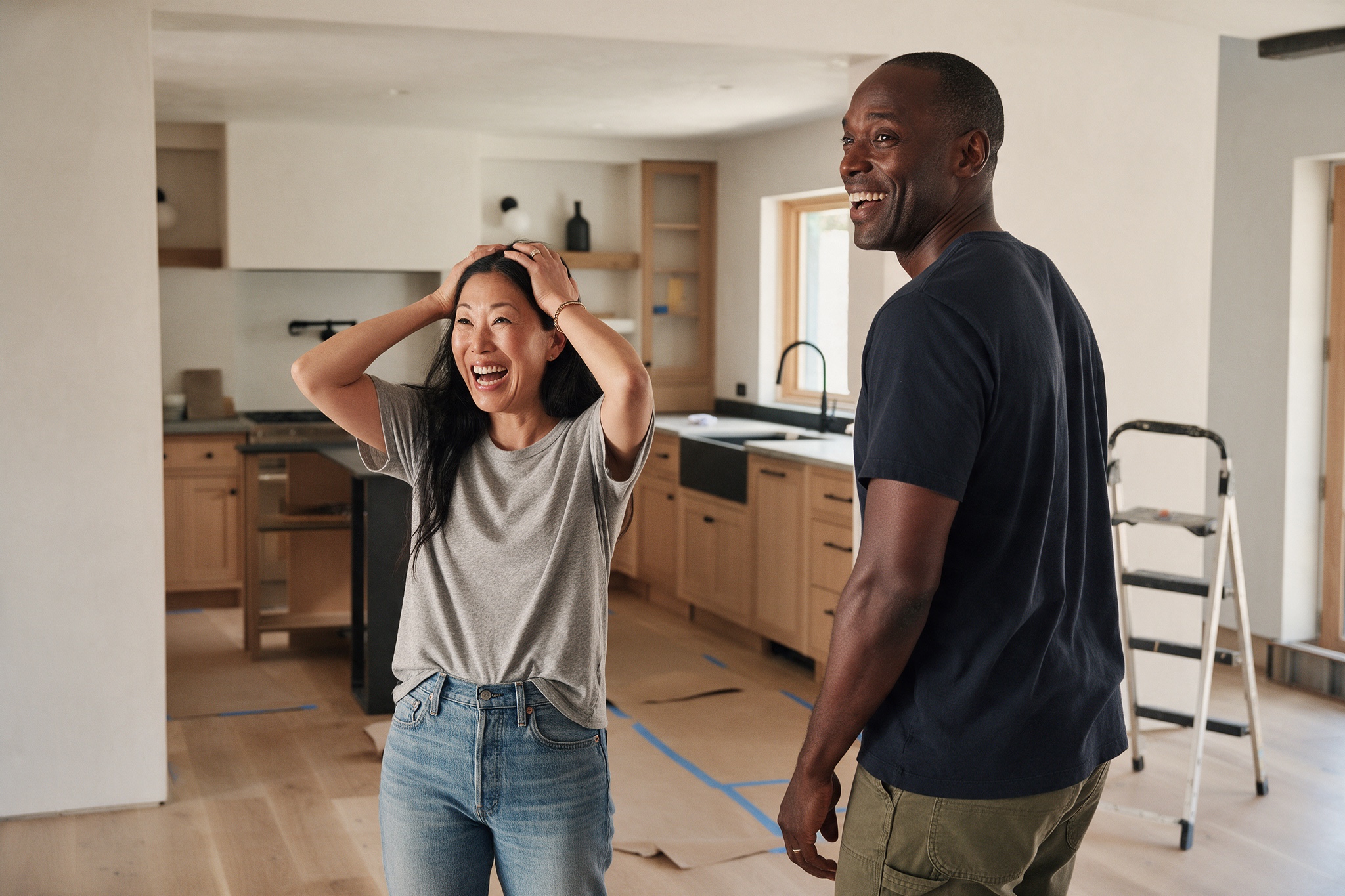 A couple seeing their finished renovation for the first time