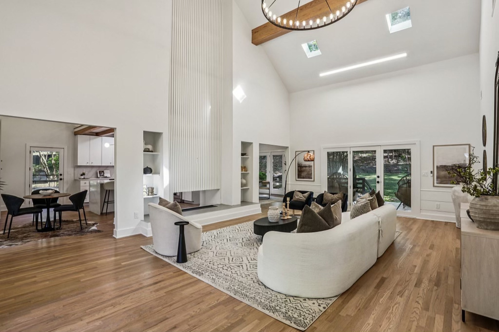 Spalding — the great room beneath an exposed beam and skylights